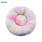 Pastel tie-dye multi-colored round fluffy plush pet bed viewed from above.