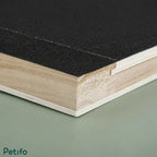 Macro close-up shot showing the textured abrasive black surface and layered wooden edge of the board.